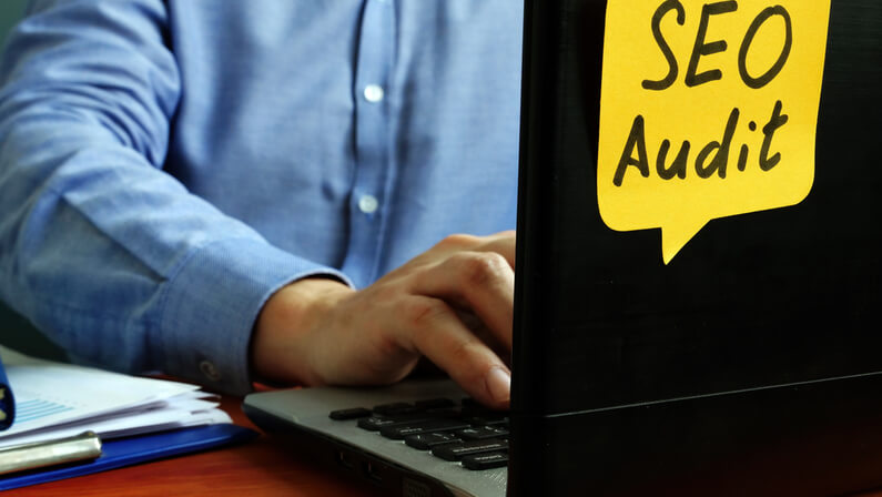 SEO audit concept specialist working on laptop