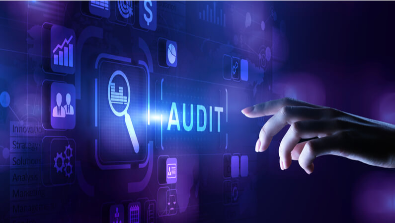 pointing hand to audit word, SEO audit
